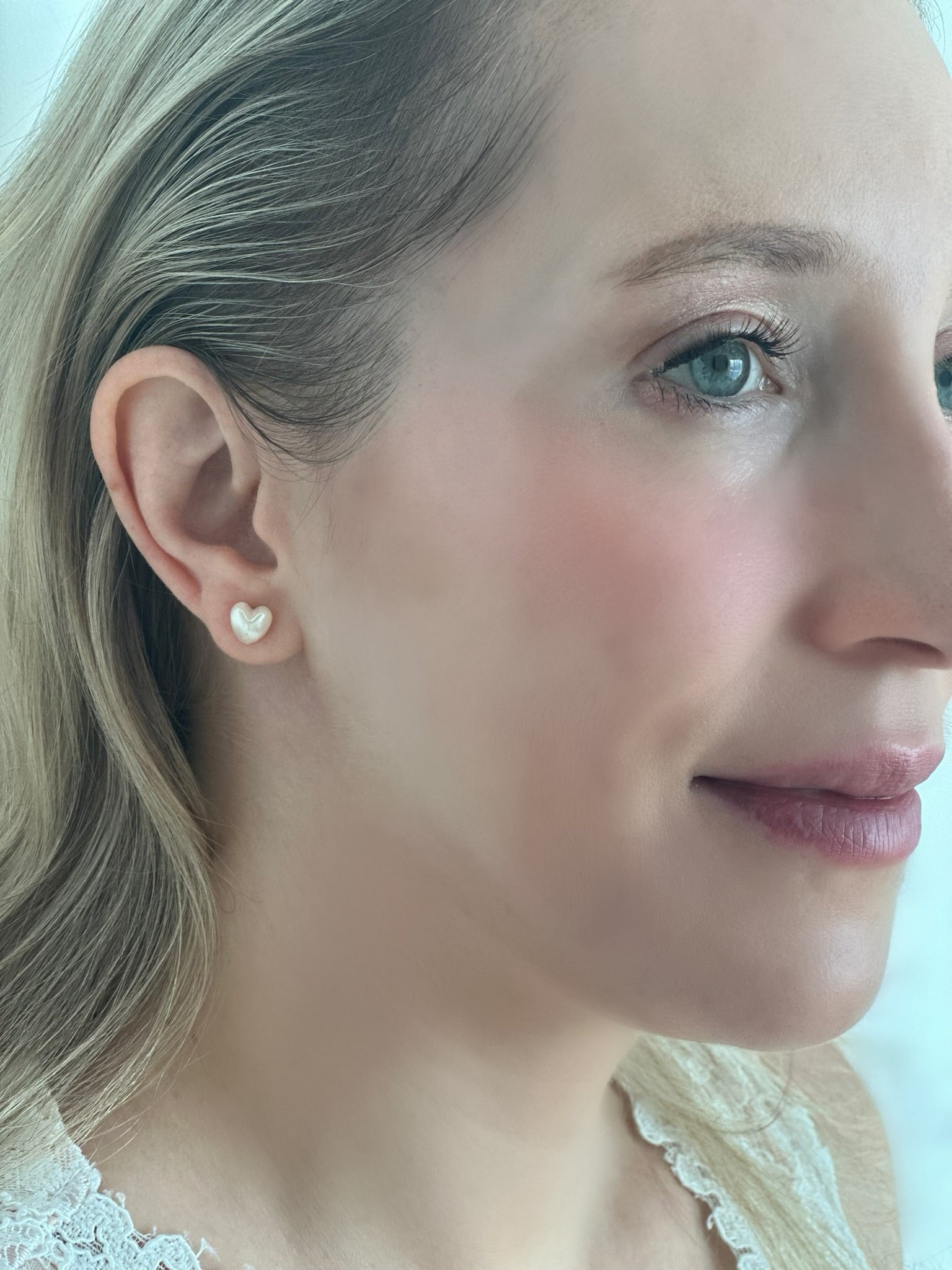 White woman wearing Akoya Heart Earrings