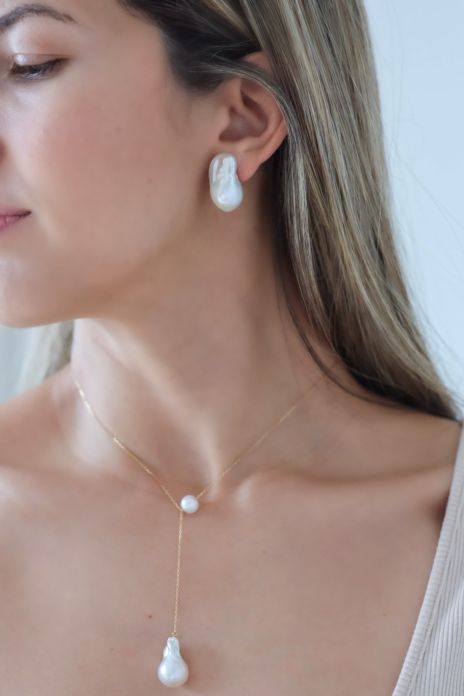 Woman wearing Baroque Pearl Stud Earrings with Baroque Pearl Long Necklace