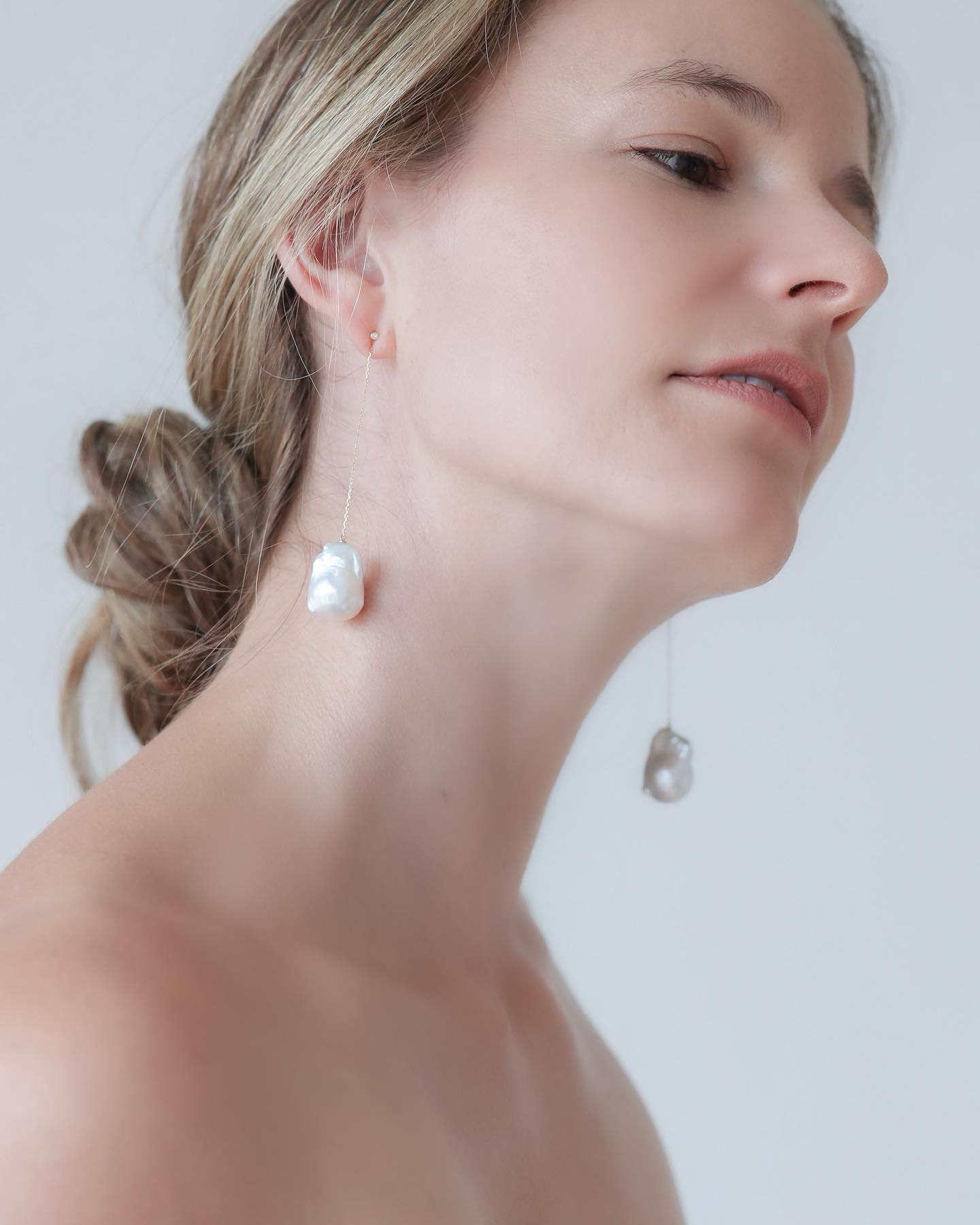 Woman wearing Baroque Pearl Swing Earrings