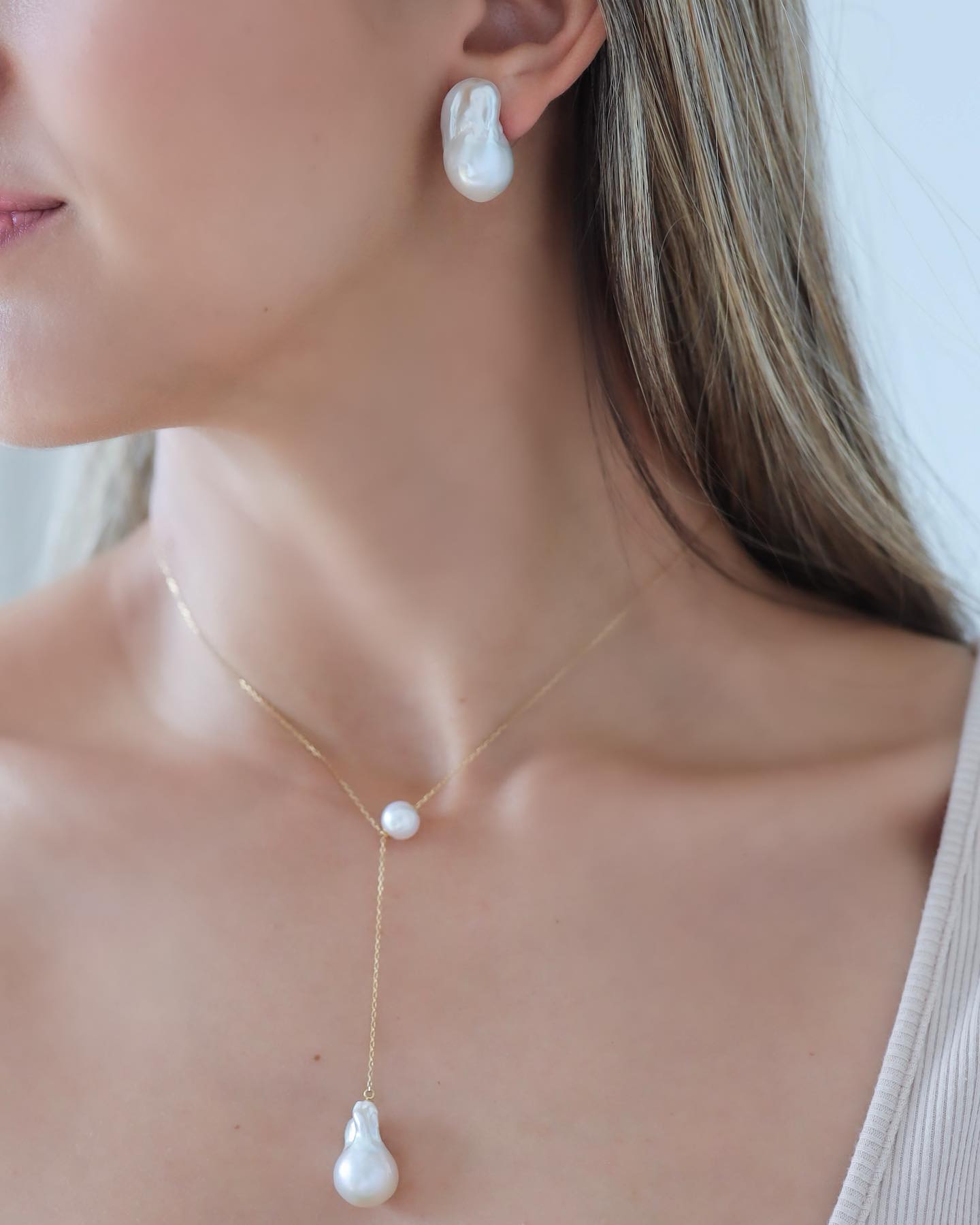 Woman wearing Baroque Pearl Stud Earring paired with Baroque Pearl Long Necklace