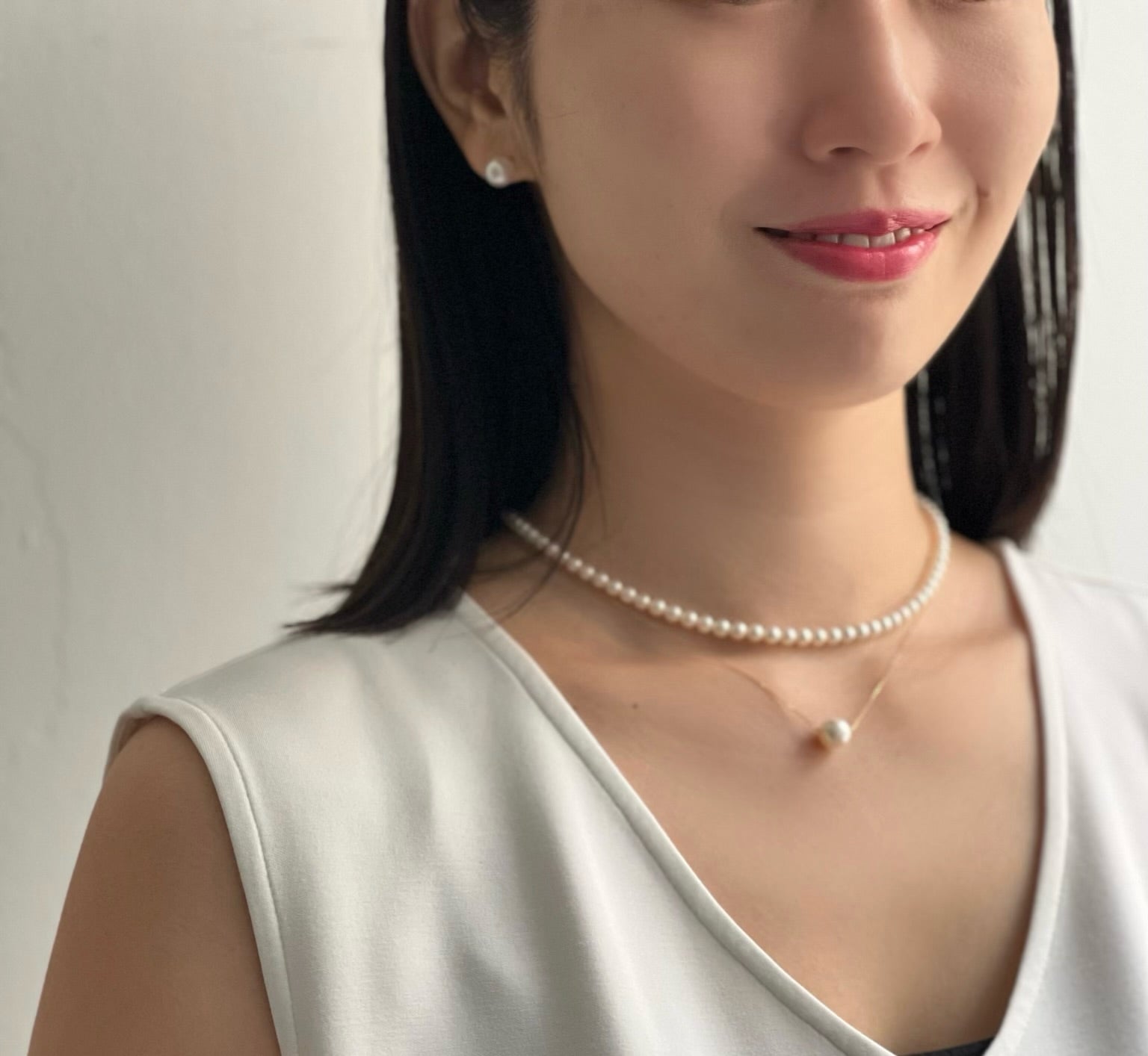 Asian woman wearing Akoya Baby Pearl Classic Necklace